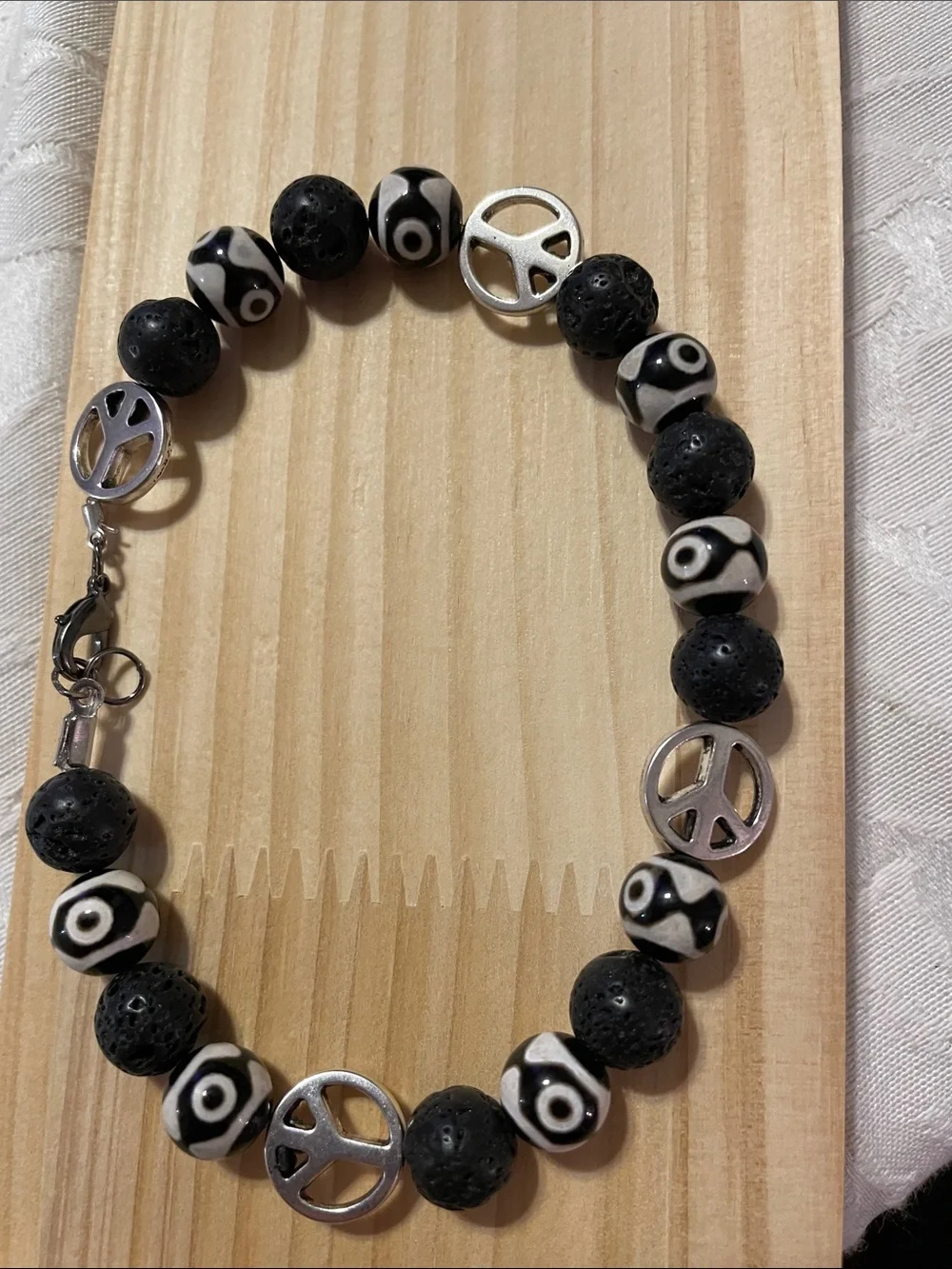 9-Bead Tibetan polish bead Anklet with lava beads and peace signs.